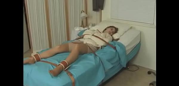  Pretty brunette in Straitjacket taped mouth forced tied to bed hospital
